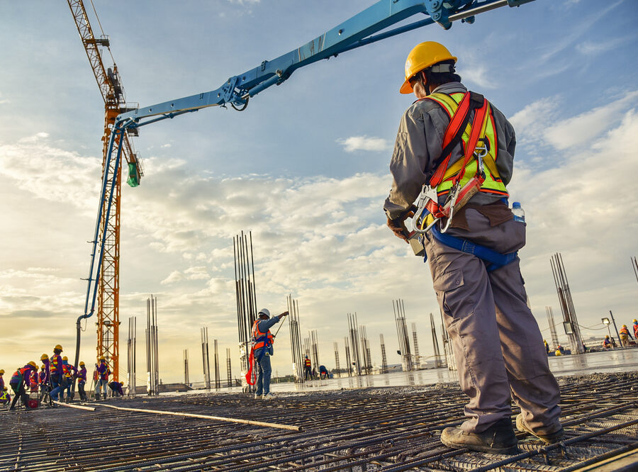 A,Construction,Worker,Control,A,Pouring,Concrete,Pump,On,Construction