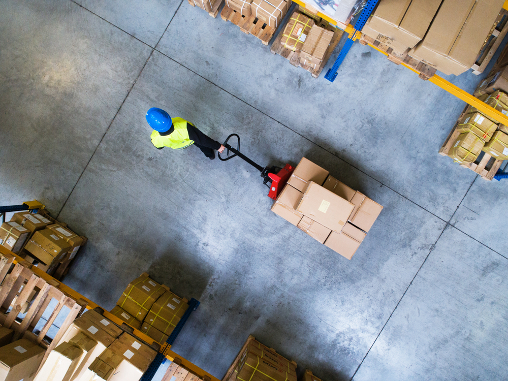 Male,Warehouse,Worker,Pulling,A,Pallet,Truck.